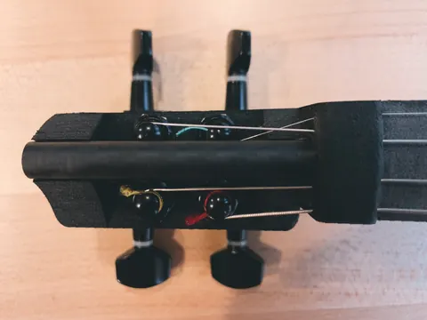 Close-up of the Hovalin head with tuners and strings
