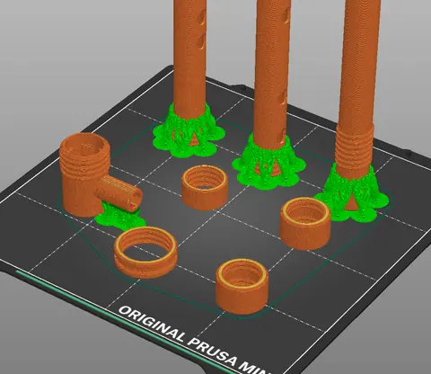 Slicer view with green paint-on support rings around three tubes