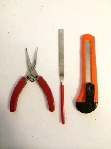 Pliers, a file and a craft knife