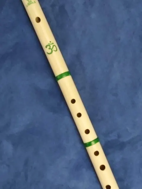 A cream print with green painted bands